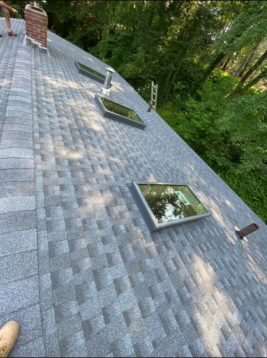 Finished shingle roof with skylights